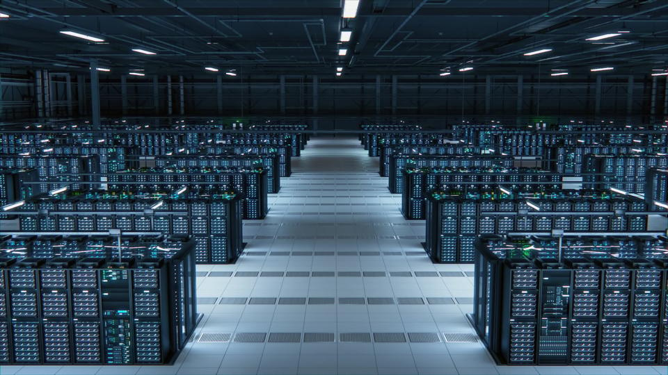 The inside of a data center with dozens of server stacks.