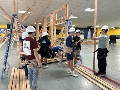 Shop Class students learning the proper techniques of framing for their tiny house build with instructor Tyler Medina with Rafael Construction.