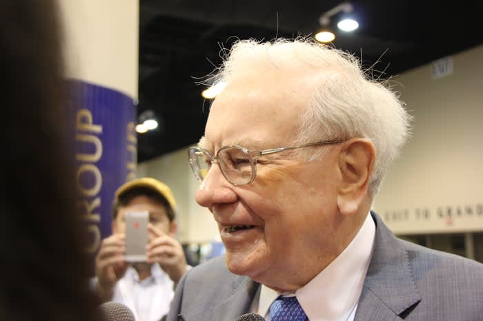 Warren Buffett talks to media.